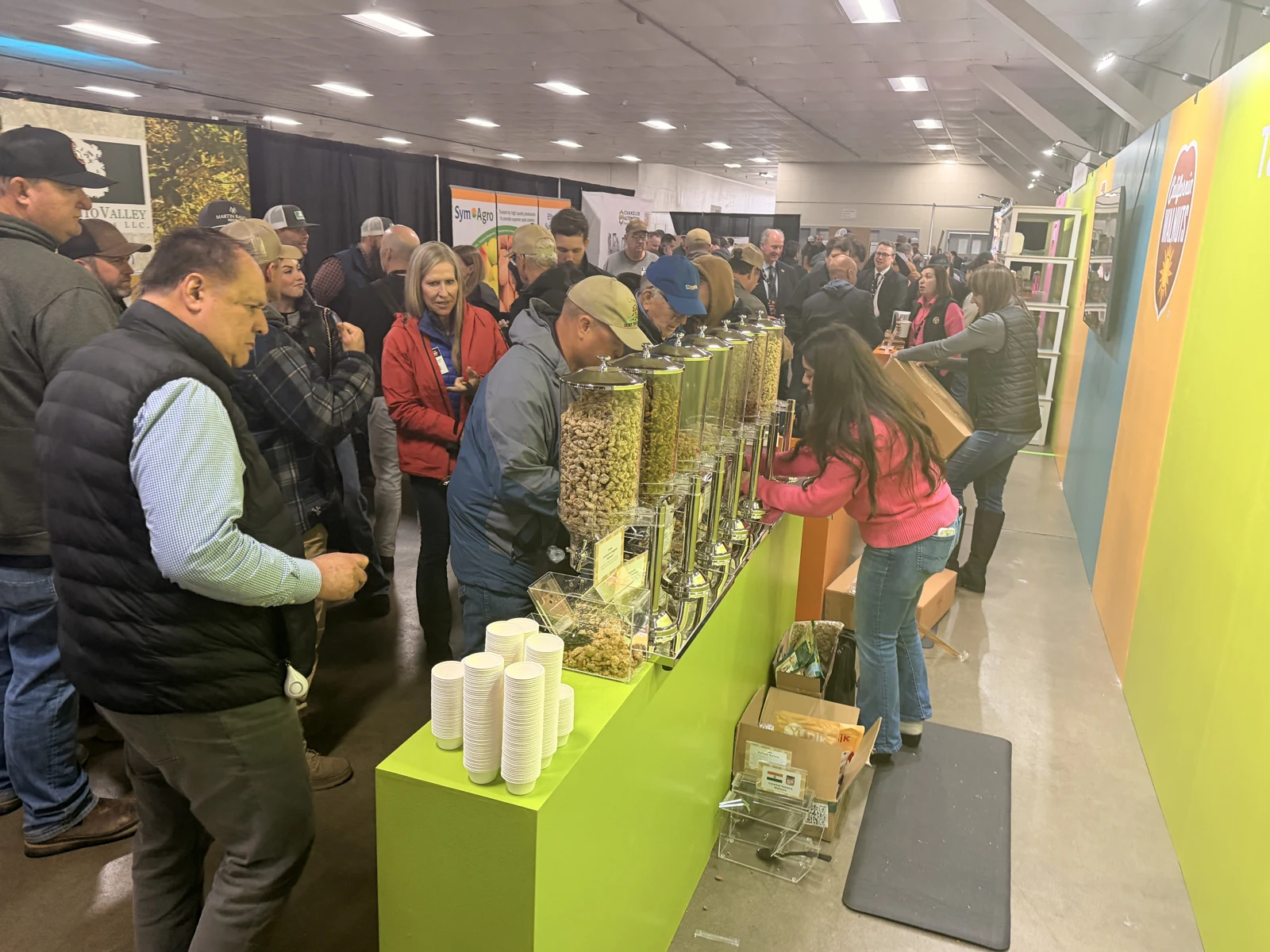 A crowd of attendees exploring the California Walnuts exhibit at California Walnut Conference in 2026.