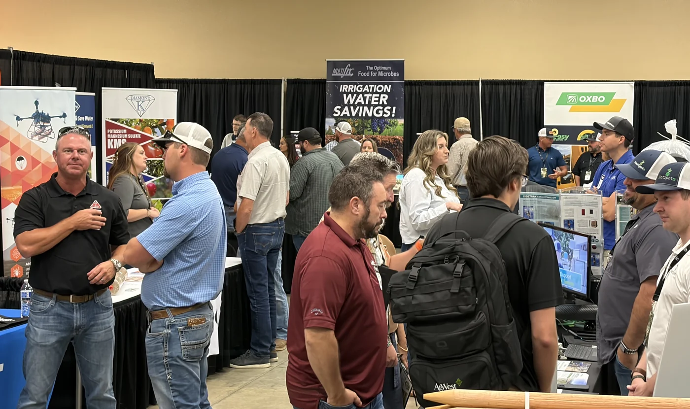 Attendees talking with exhibitors on the Pistachio Day show floor in 2026.